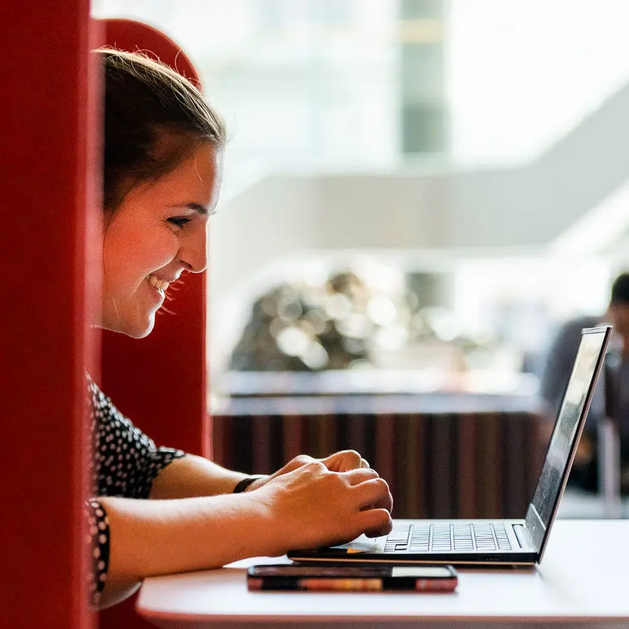 Student at laptop taking online recorded class