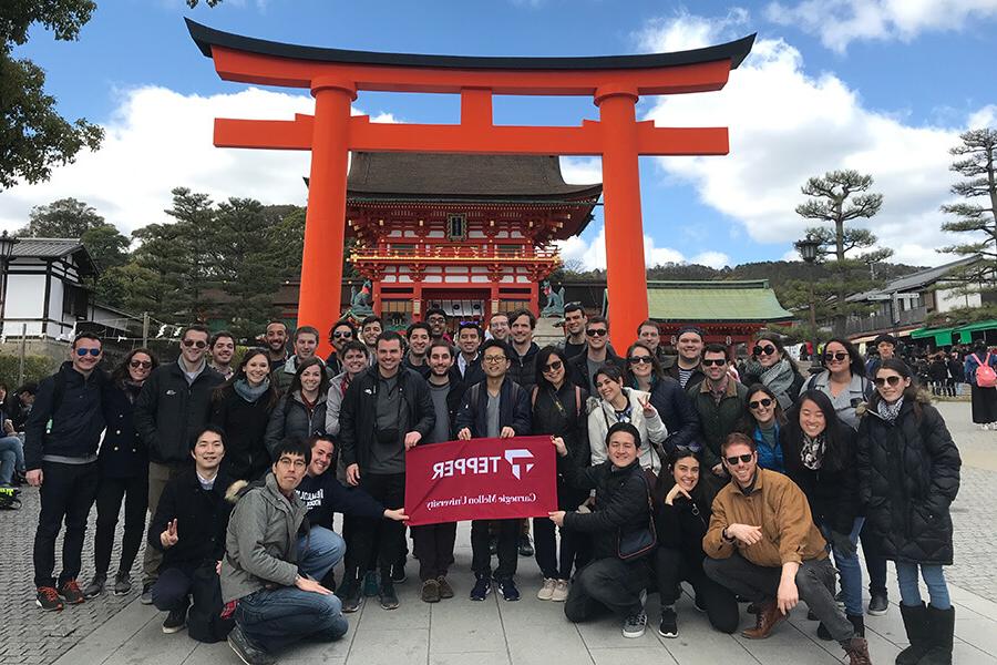 Student in Japan in front of a temple